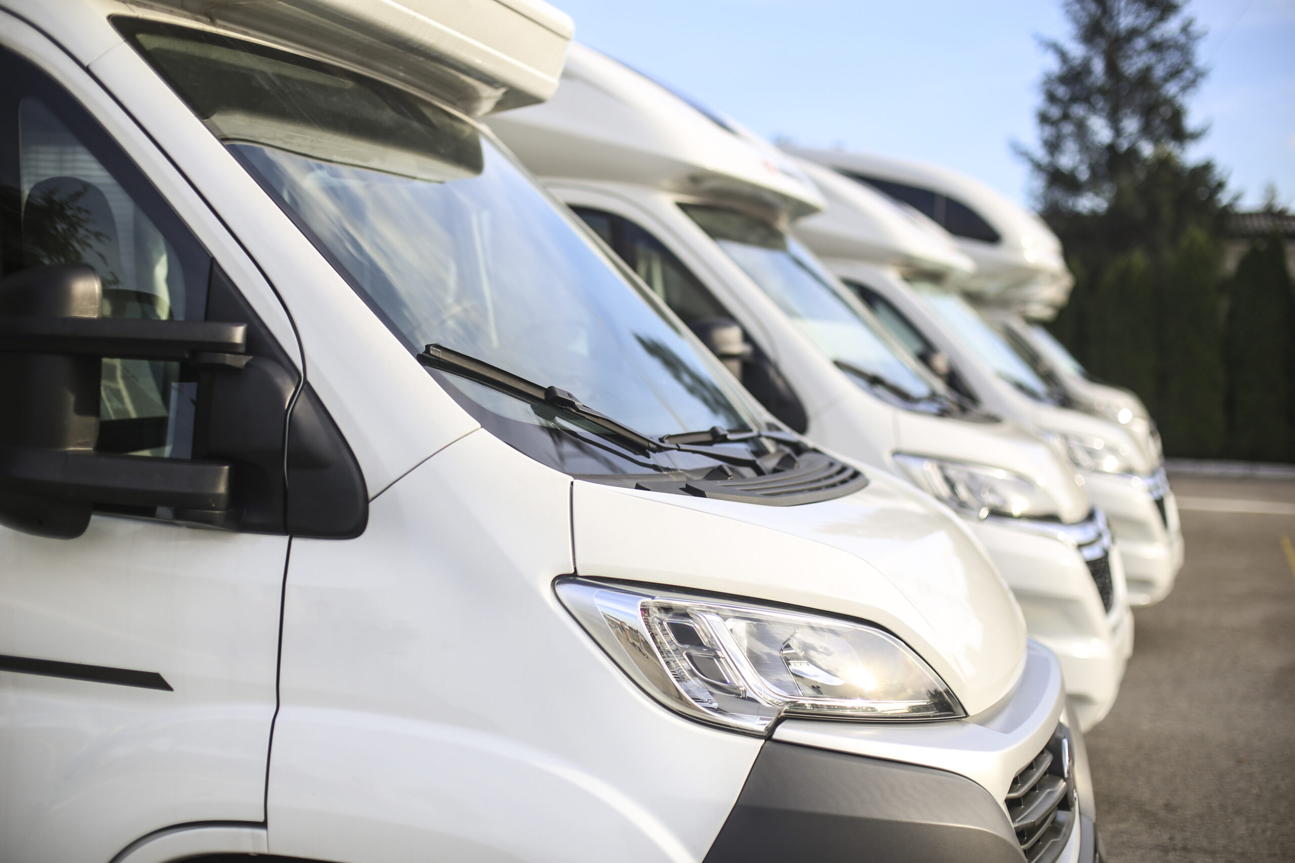 Row of recreational vehicles on a parking (camper trailer)