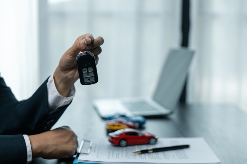 Guy holding car key
